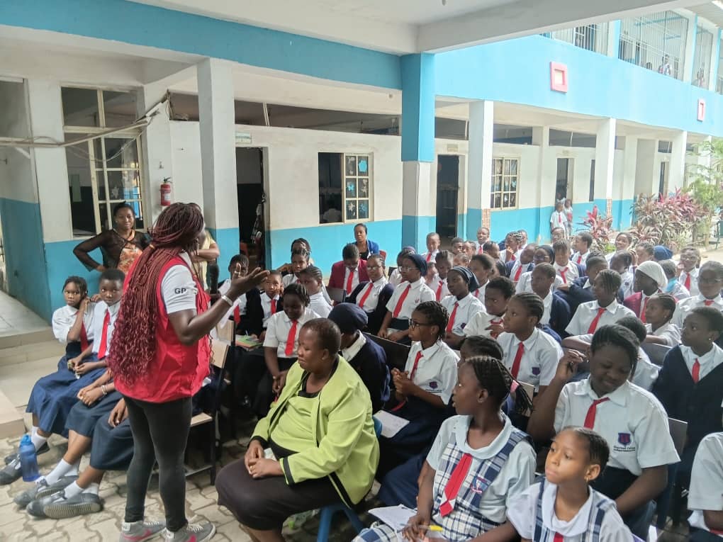 Vera during world menstrual hygiene day in Abuja talking to students